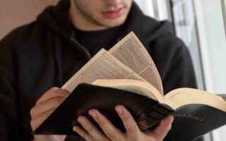 Young man reading a Bible