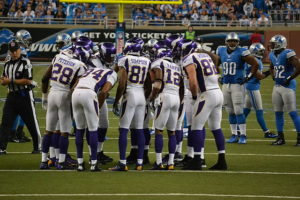 Football Offense in Huddle