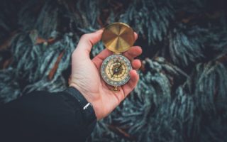 Person holding compass